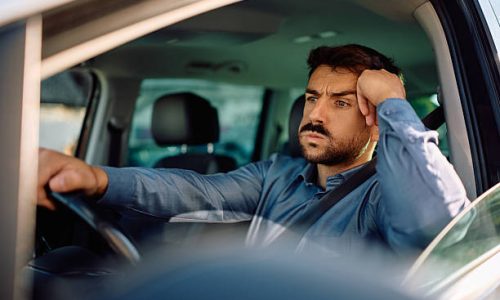 Displeased driver stuck in a traffic jam.